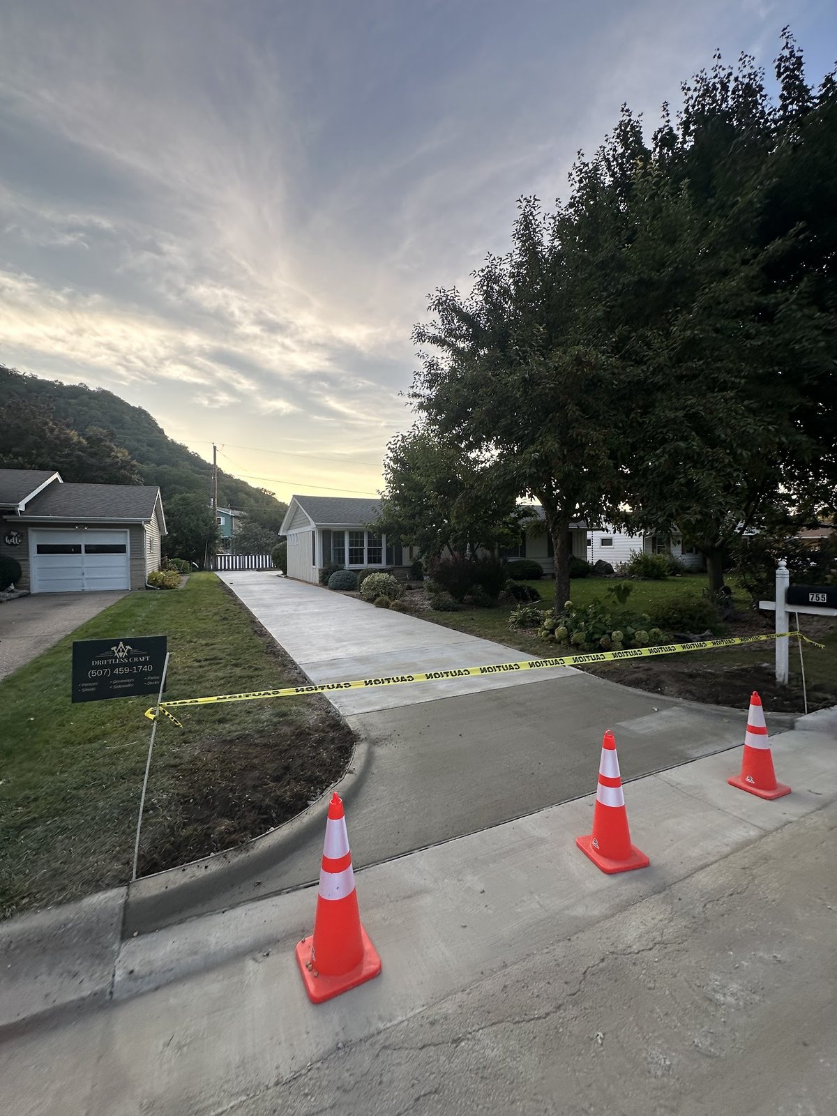Completed residential concrete driveway and front approach by Driftless Craft