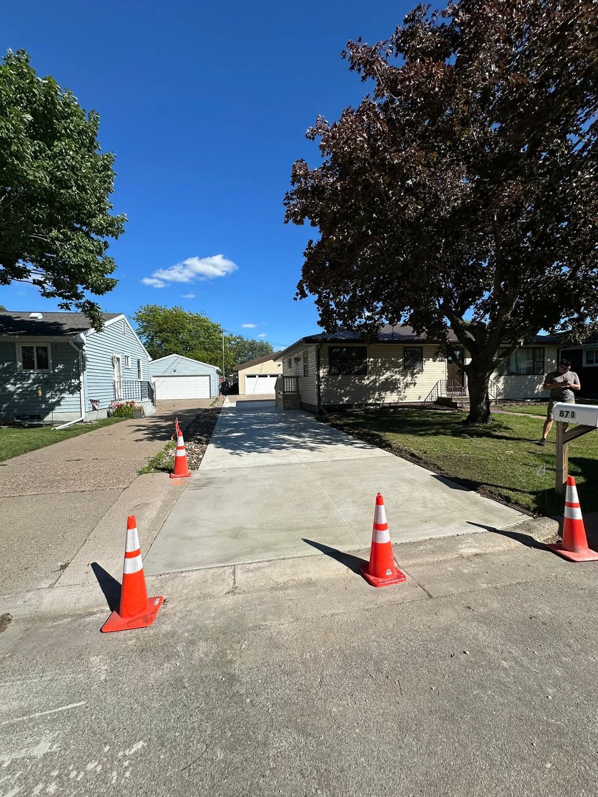 Driveway Replacement — Existing concrete removed and the site opened for reconstruction.