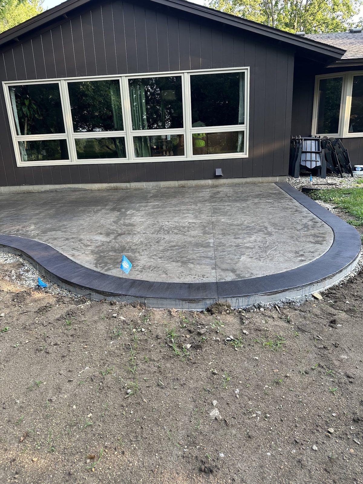 Completed Curved Patio — Wide finished view of the stamped patio and contrasting border.